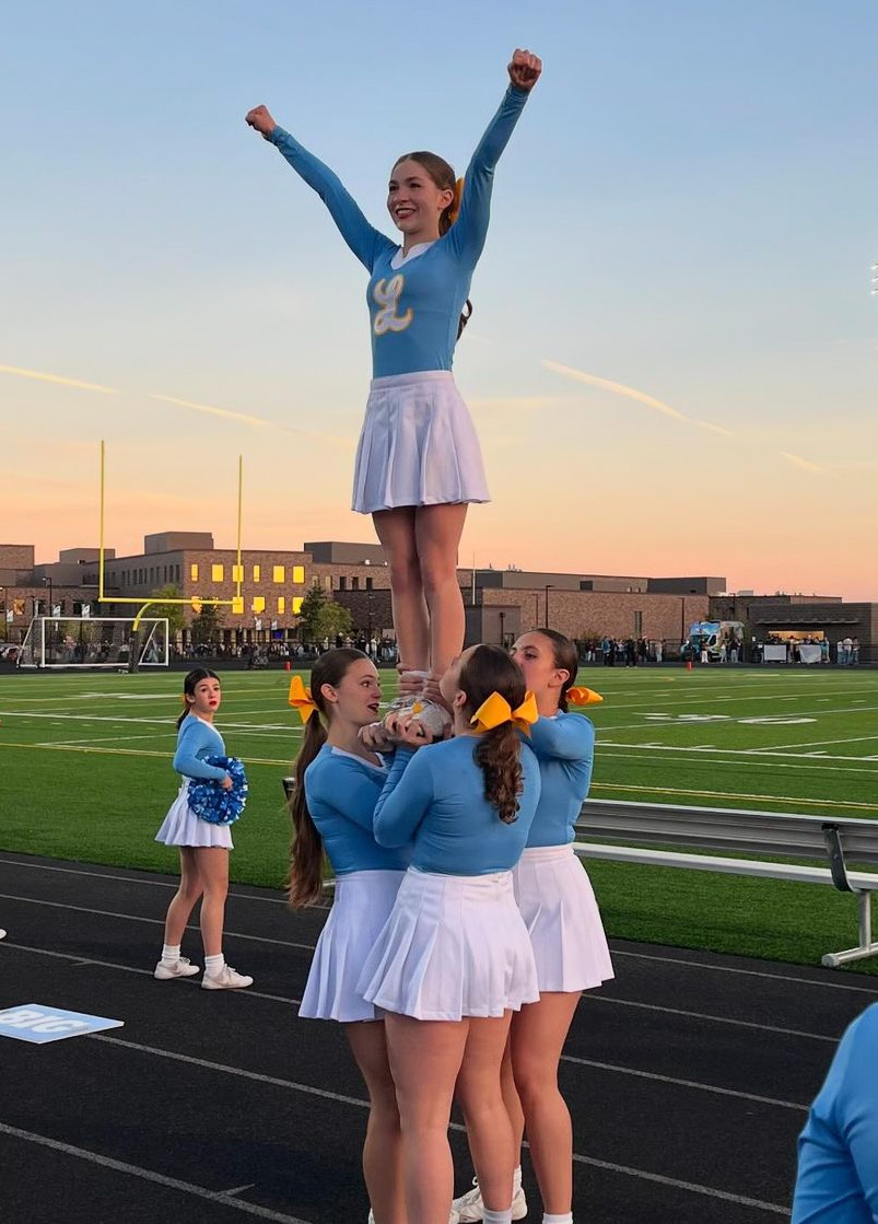 Cheer expands roster and wins